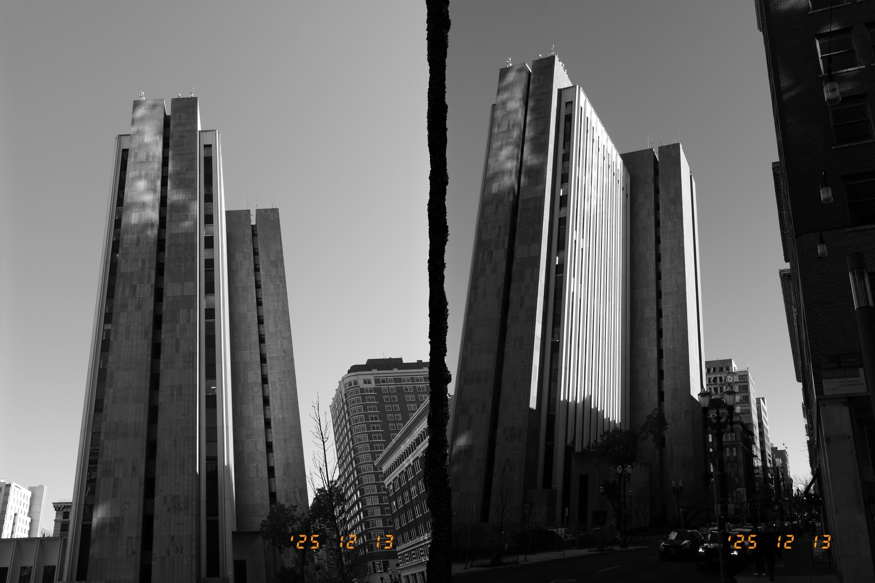 Diptych of a Portland skyscraper from two slightly different angles in monochrome