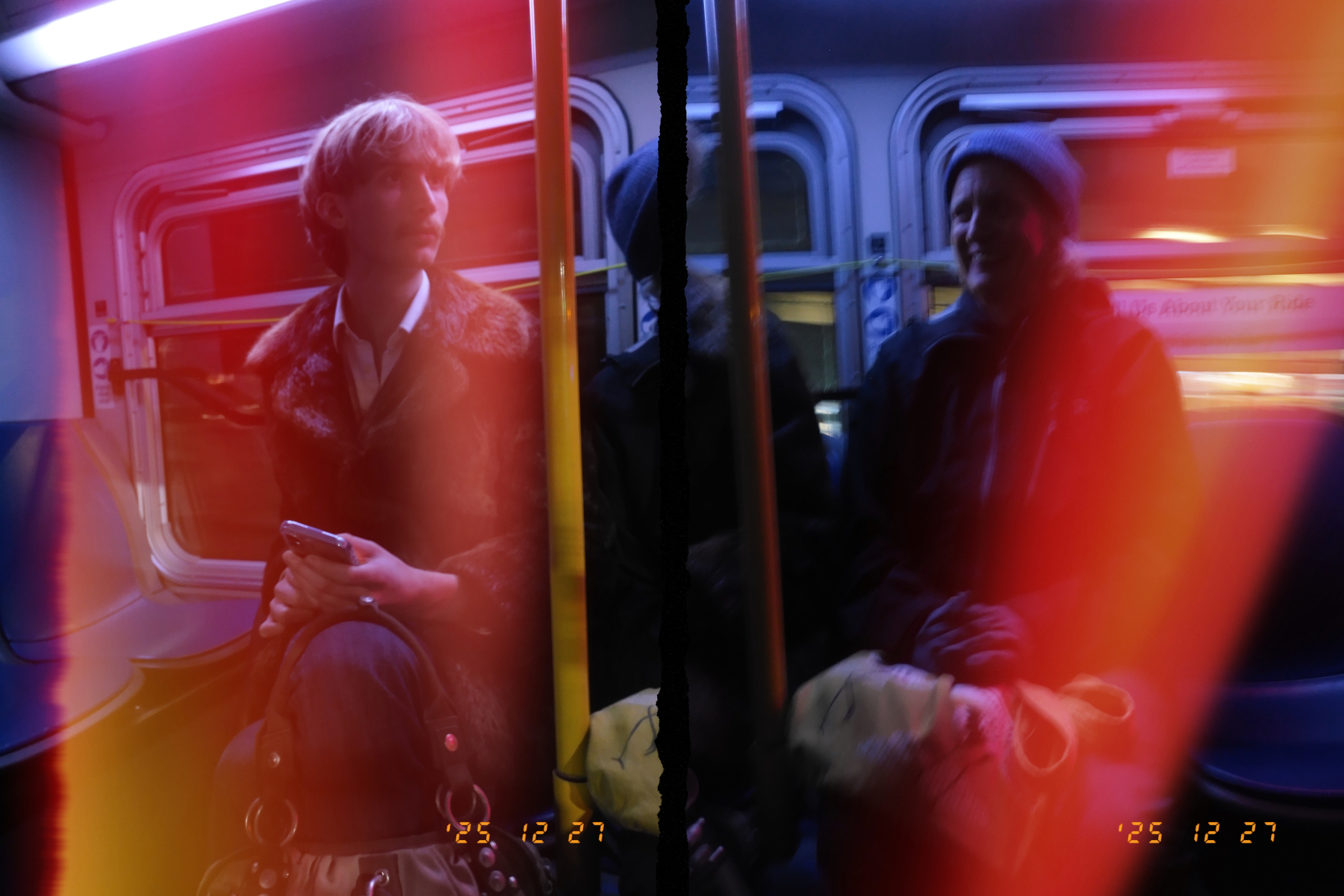 Two people sit opposite each other on a bus, with a colorful light leak effect creating a vibrant overlay.